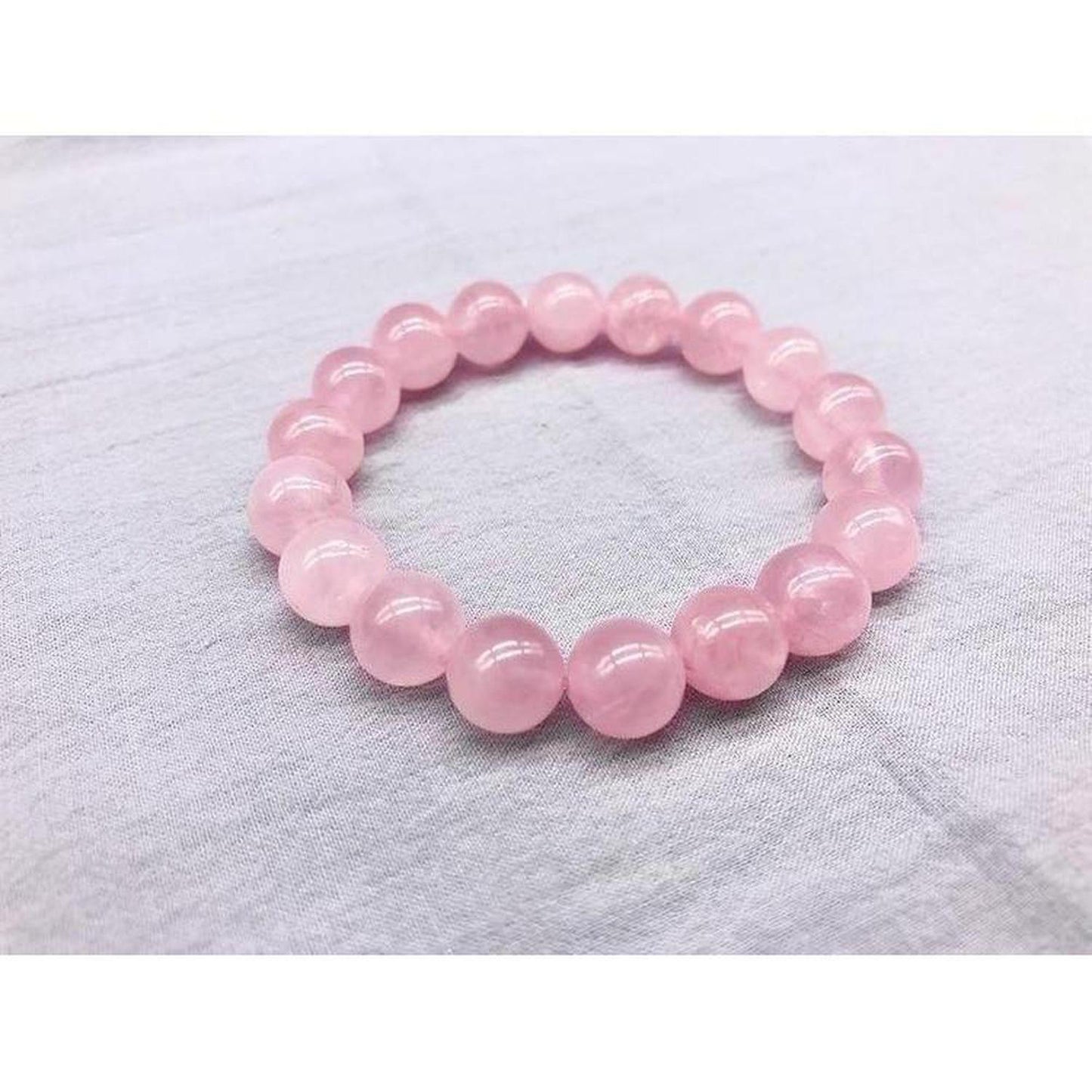 Natural Rose Quartz Bracelet | Stone of Love & Emotional Healing - Shop the Rose Quartz Bracelet with 10mm beads. The Stone of Love promotes self-love, healing, inner peace, and attracts positive relationships. Ideal crystal jewellery. Buy Now at Sacred Remedy