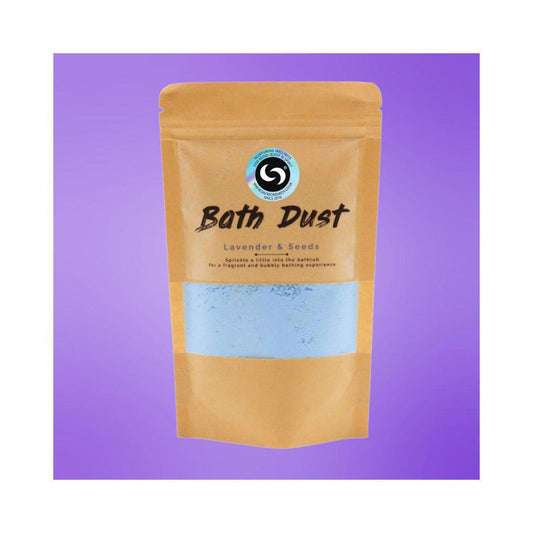 Lavender and Seeds bath dust in a resealable kraft pouch with a clear window revealing light blue powder against purple.