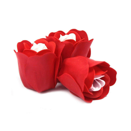 Three artisanal red rose soap flowers with white centers, crafted for a luxurious bath experience.