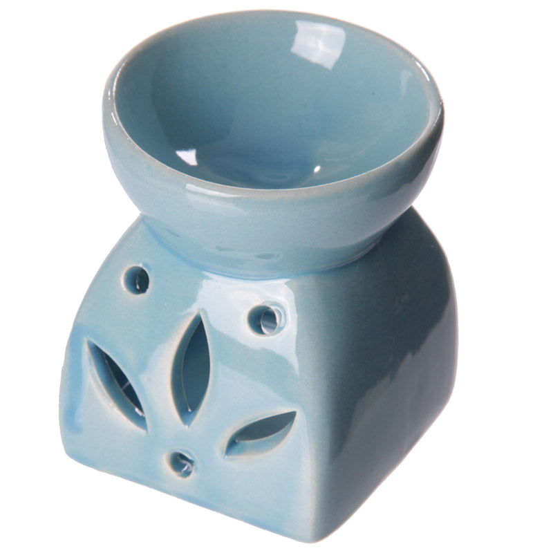 Buy Modern Cermaic Oil Burner. Wax Melts, Essential Oils, Water. - This ceramic oil burner features a cut-out leaf design that allows a vivid, beautiful flame to dance through the openings as it warms your space. Use it with at Sacred Remedy Online