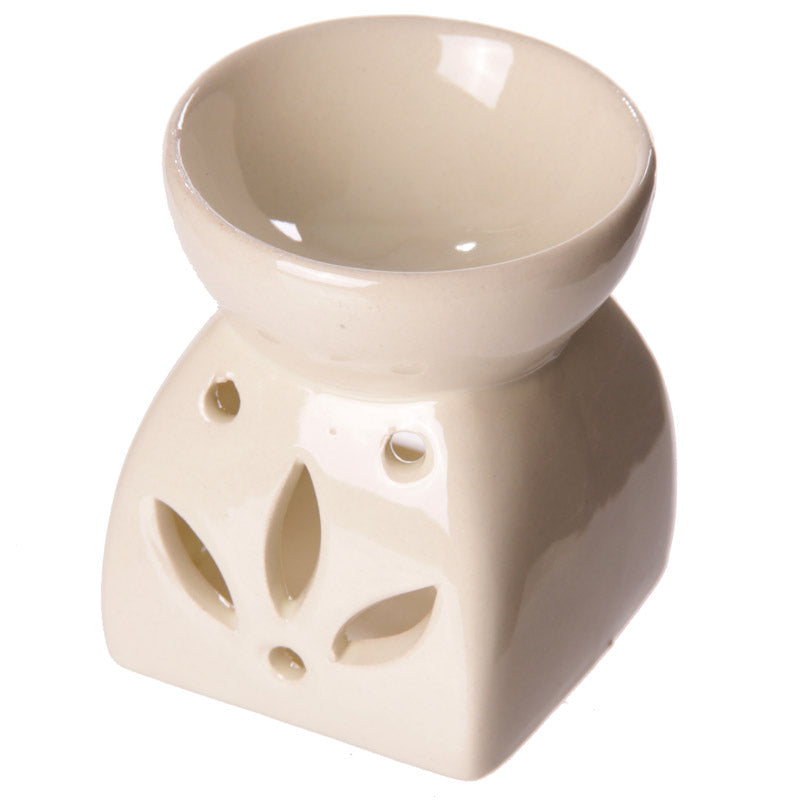 Buy Modern Cermaic Oil Burner. Wax Melts, Essential Oils, Water. - This ceramic oil burner features a cut-out leaf design that allows a vivid, beautiful flame to dance through the openings as it warms your space. Use it with at Sacred Remedy Online