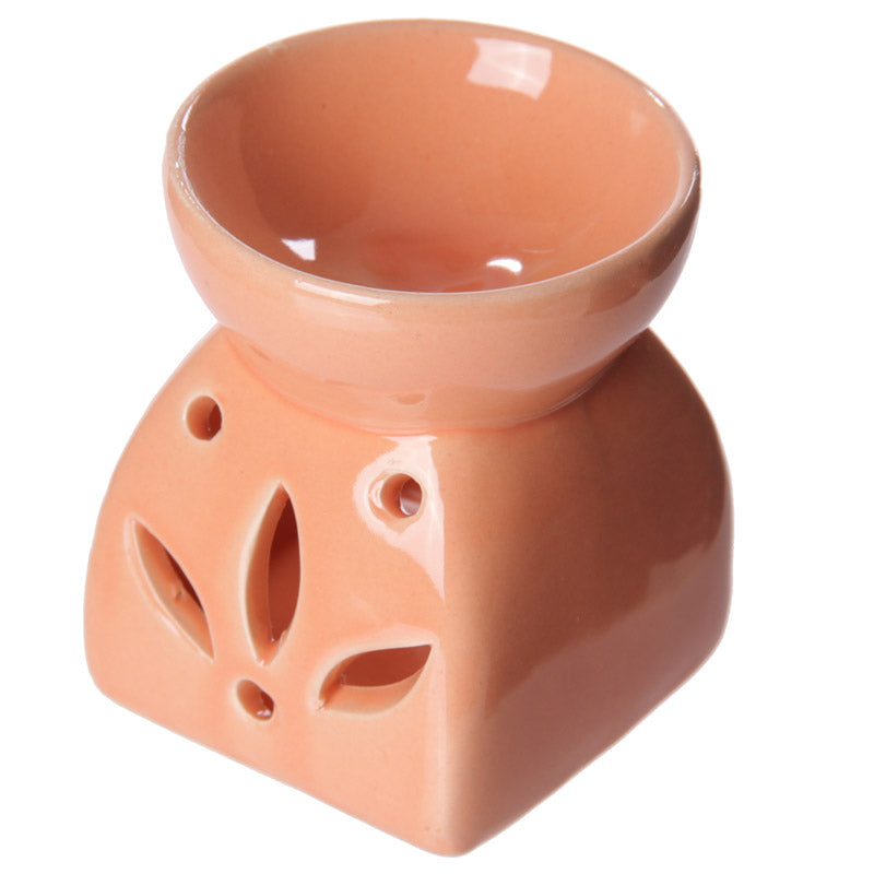 Buy Modern Cermaic Oil Burner. Wax Melts, Essential Oils, Water. - This ceramic oil burner features a cut-out leaf design that allows a vivid, beautiful flame to dance through the openings as it warms your space. Use it with at Sacred Remedy Online