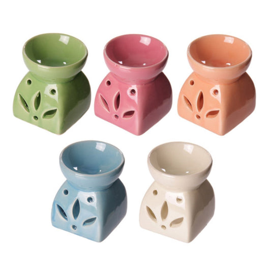 Buy Modern Cermaic Oil Burner. Wax Melts, Essential Oils, Water. - This ceramic oil burner features a cut-out leaf design that allows a vivid, beautiful flame to dance through the openings as it warms your space. Use it with at Sacred Remedy Online