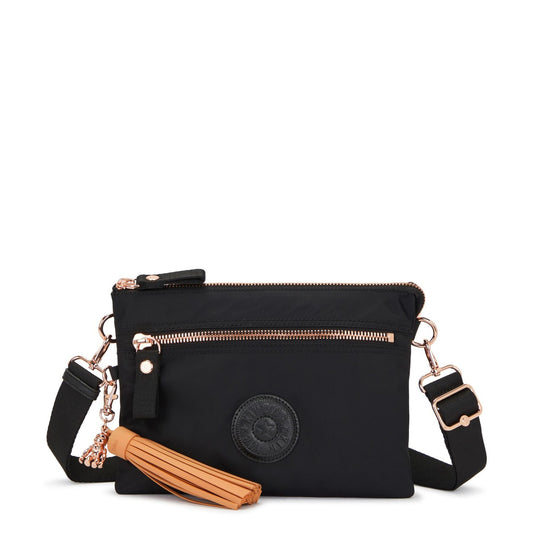 Buy Kipling Riri Large Crossbody Bag with Removable Strap | Rose Black - Looking for a stylish and functional crossbody bag that goes from work to weekend? Look no further than the Kipling Riri L in Satin Blue! This lightweight and roomy bag boasts a beautiful Black with Rose Gold finish and is packed with features to keep you organized. at Sacred Remedy Online