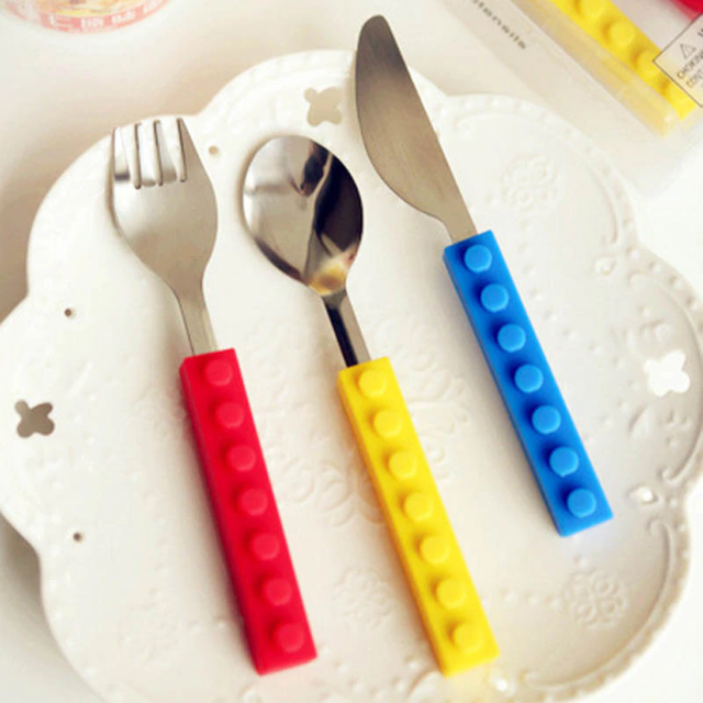 Fun Stacking Kids Cutlery Set | Teach Independent Eating - Bright, stacking block design cutlery for children. Encourages independent eating & chopping. Durable stainless steel, silicone handles. Perfect for home & travel. Buy Now at Sacred Remedy