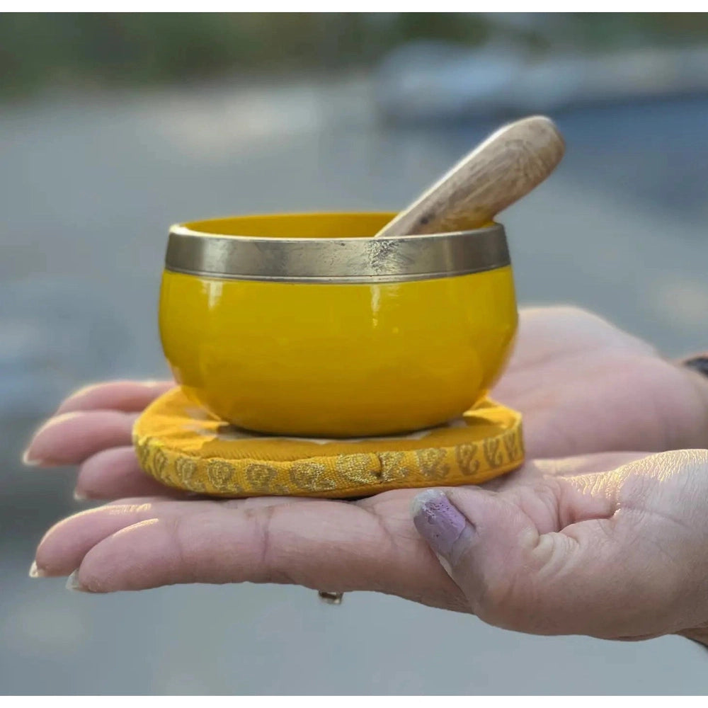 Buy Solar Plexus Chakra Singing Bowl Gift Set. Meditation & Sound Therapy - A singing bowl is played by resting the bowl on the flat of the hand and rotating the stick around the outside rim of the bowl. The perfect Chakra gift, use the wood end of the stick to make the bowl sing. A gift that will make someone more than happy - bringing a little extra inner calm. at Sacred Remedy Online