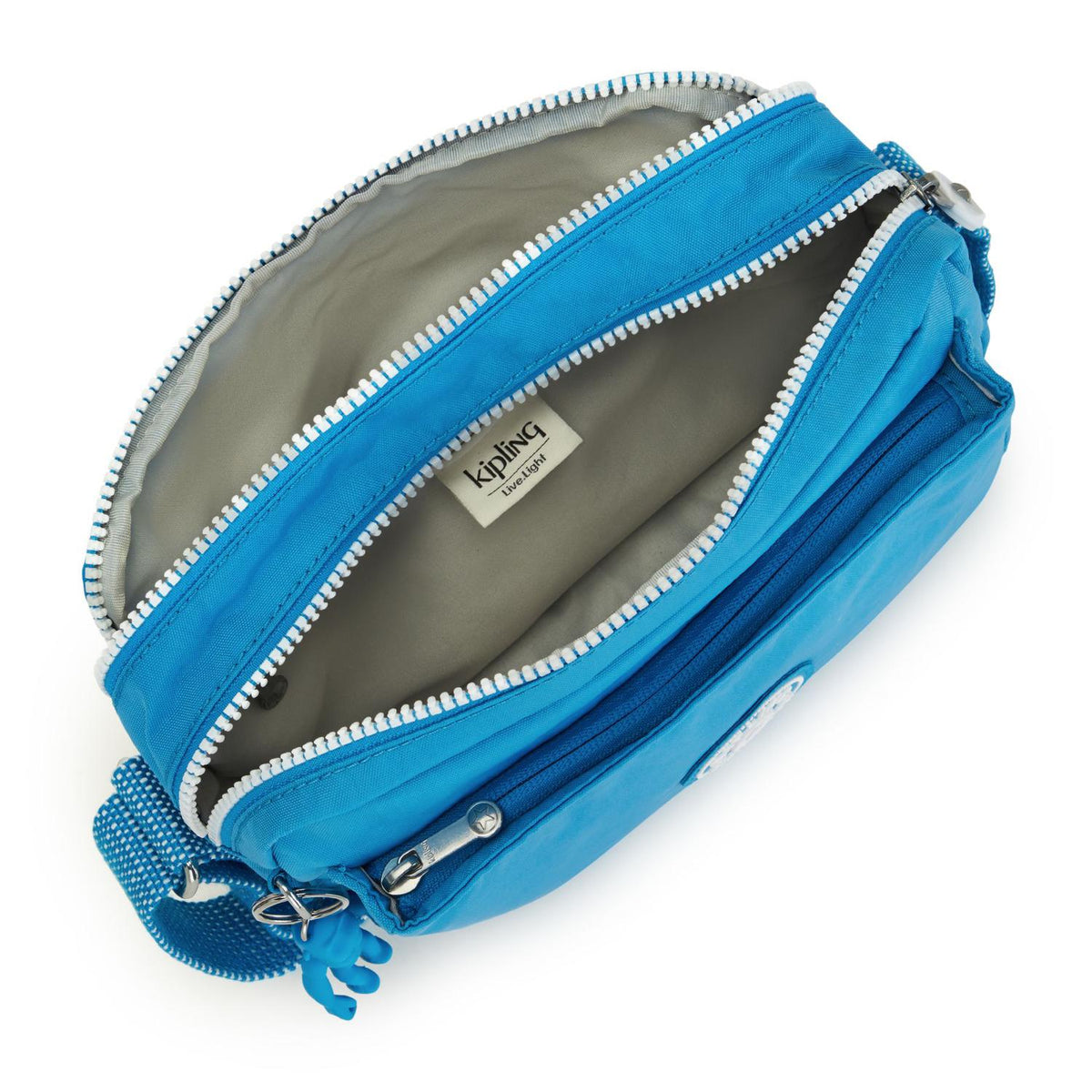 Kipling Abanu mini crossbody bag in Eager Blue with an open zippered main compartment and grey interior lining.
