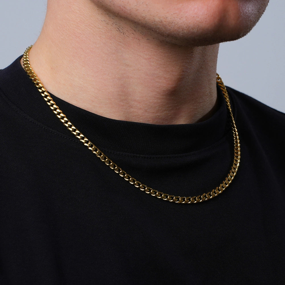 18K Gold Plated Cuban Chain (5mm) | Waterproof & Tarnish-Proof - Elevate your style with our durable 5mm wide 18K Gold Plated Cuban Chain. Waterproof, tarnish-proof, and hypoallergenic, it's the perfect everyday accessory. Buy Now at Sacred Remedy