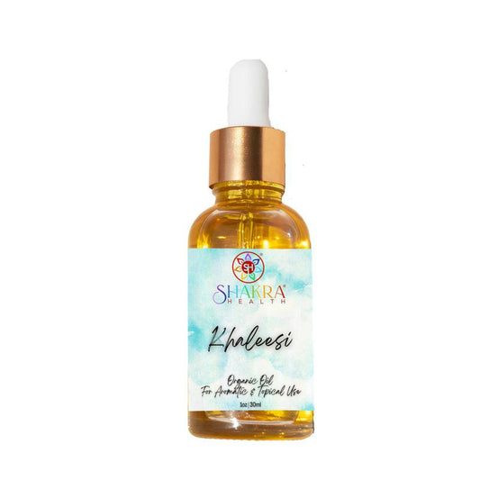 30ml amber glass dropper bottle of Khaleesi ritual oil with a gold cap and a blue watercolor-style product label.