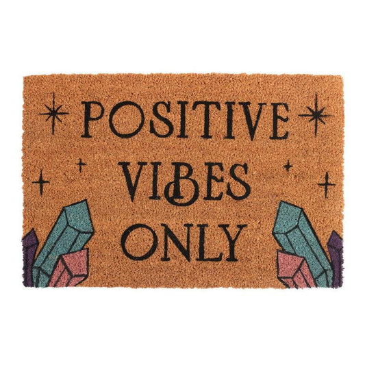 Natural coir doormat with Positive Vibes Only text, star accents, and colorful crystal illustrations.