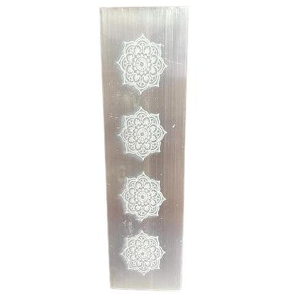 Rectangular white selenite charging plate featuring four intricate laser-etched mandala designs in a vertical row.